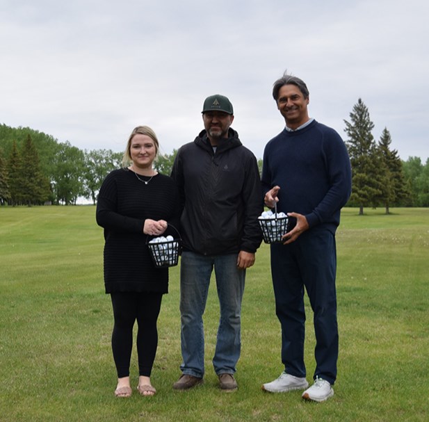The Canora golf course opens to the public from May 1 to mid-October. From left to right, Meaghan Hadubiak, real estate agent at RE/MAX Blue Chip Realty who works in Canora, Darcy Sliva, course superintendent at the Canora Country Club who takes care of the entire course, and Robert Kozak, owner at RE/MAX Blue Chip Realty, who said the donation of the range balls took a couple years of planning.