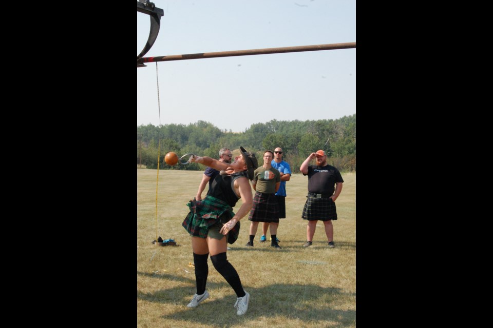 Both men and women throw a 56 lb weight in the weight over bar. Heather Ross of Lloydminster was successful in throwing her weight over the bar at nine feet. 