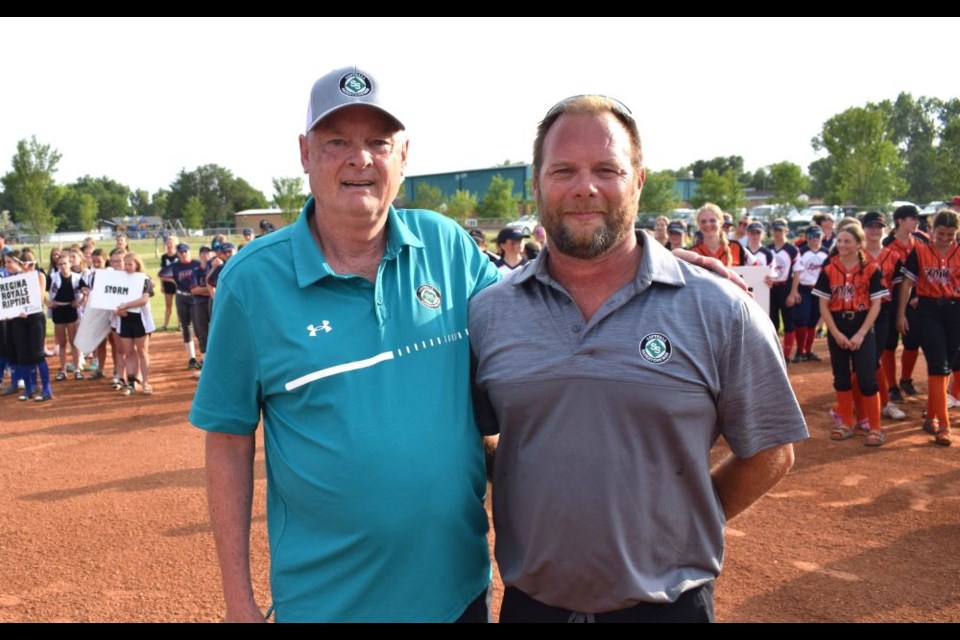 Jody Waloshin, right, was congratulated by Softball Saskatchewan executive director Guy Jacobson. 