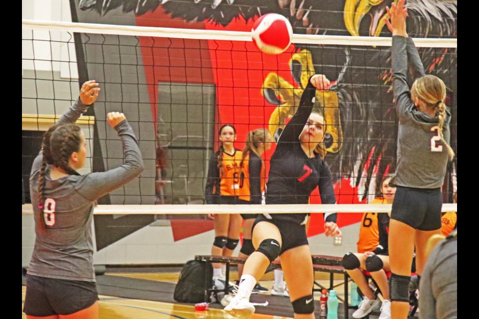 WCS player Karis Gerle, No. 7, spiked the ball over the net to the WCS Jr. B team, at the junior girls tournament on Saturday.