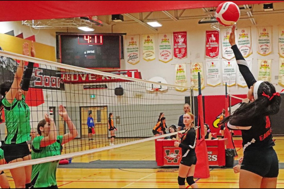 WCS Eagles player Yuna Lee hit the ball back over to Ogema, on this play during a round-robin game on Friday.