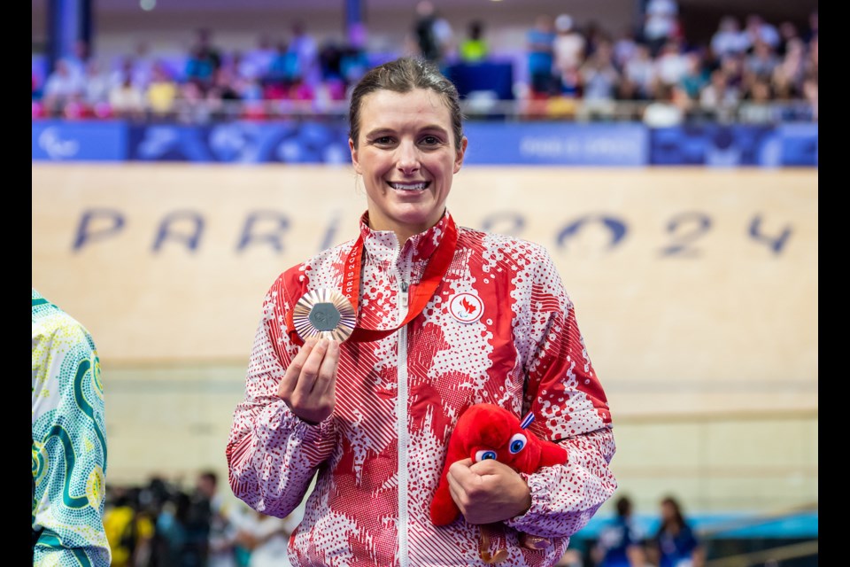 Keely Shaw proudly shows off her latest Paralympic bronze medal. 