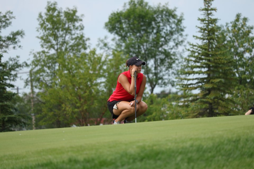 Ella Kozak lines up a putt in Saskatchewan Junior Women’s Championship  action Friday.