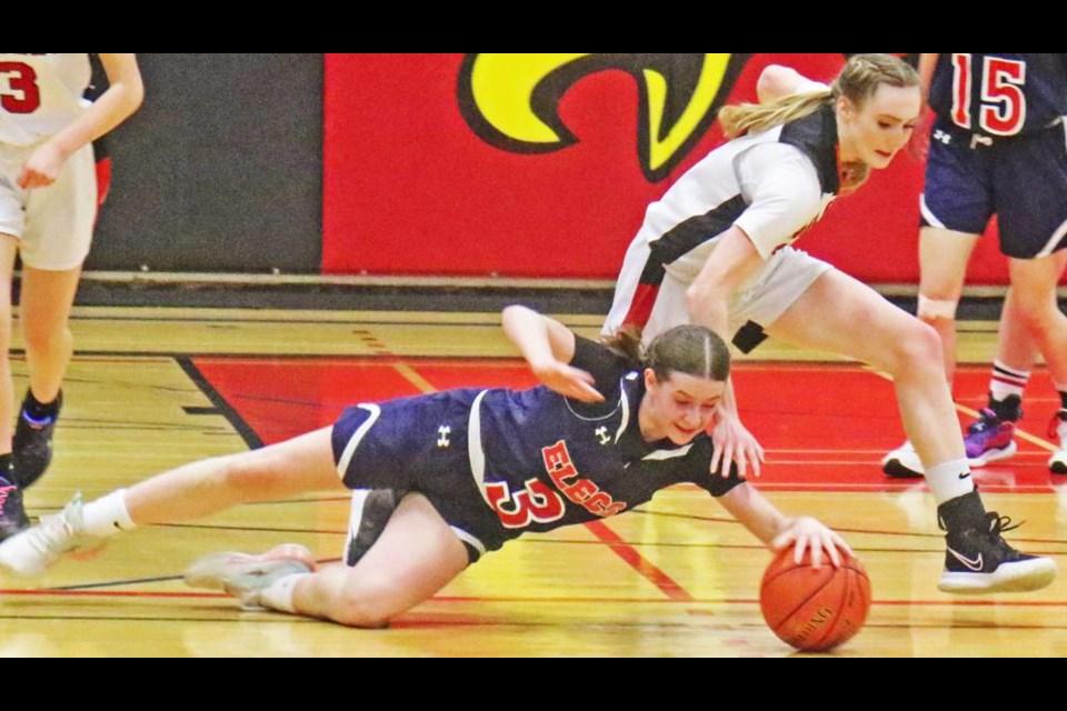 WCS Eagles player Aycen Schwindt goes after the ball as an Elecs player falls on this play.