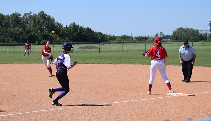 Jailin Soltys of the U17 Reds girls softball team threw out this Preeceville baserunner after picking up a grounder from her position at second base during Canora Minor Ball Day on June 10.