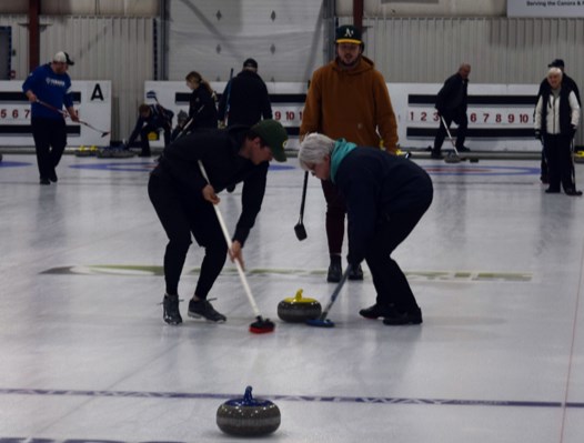 After releasing this rock, Mathew Wilgosh offered encouragement to the sweepers, his brother Vaughn and their mom, Karen, at the Canora Mixed Windup Bonspiel.