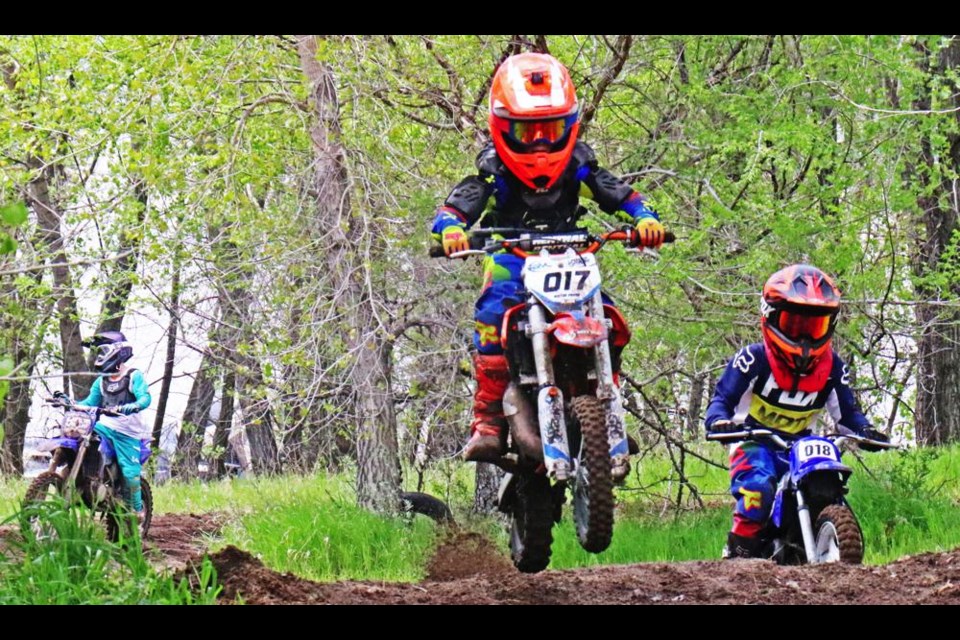 Three young riders put in some practice time on the track after races were cancelled in Weyburn in 2022.