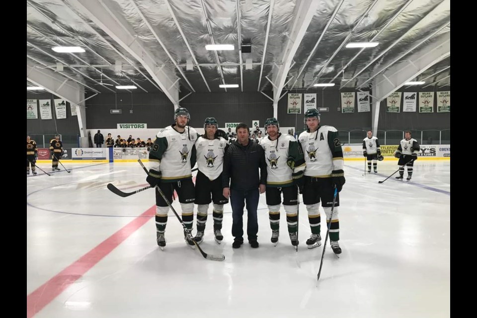 Wilkie Outlaws players were recognized for their achievements in the SWHL awards at their Feb. 6 game. Left to right: Blake Young (second team all-star), Brock Harrison (first team all-star, most gentlemanly, top scorer), league president Joe Cey, Derek Keller (first team all-star, top defenceman, league MVP) and Rory Gregoire (first team all-star).