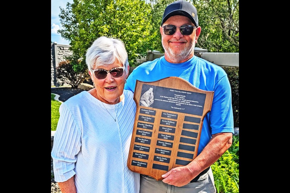 Marie Grohn was presented with the Perry Folk Fellowship Award by Kevin Folk on Wednesday, on behalf of the family.