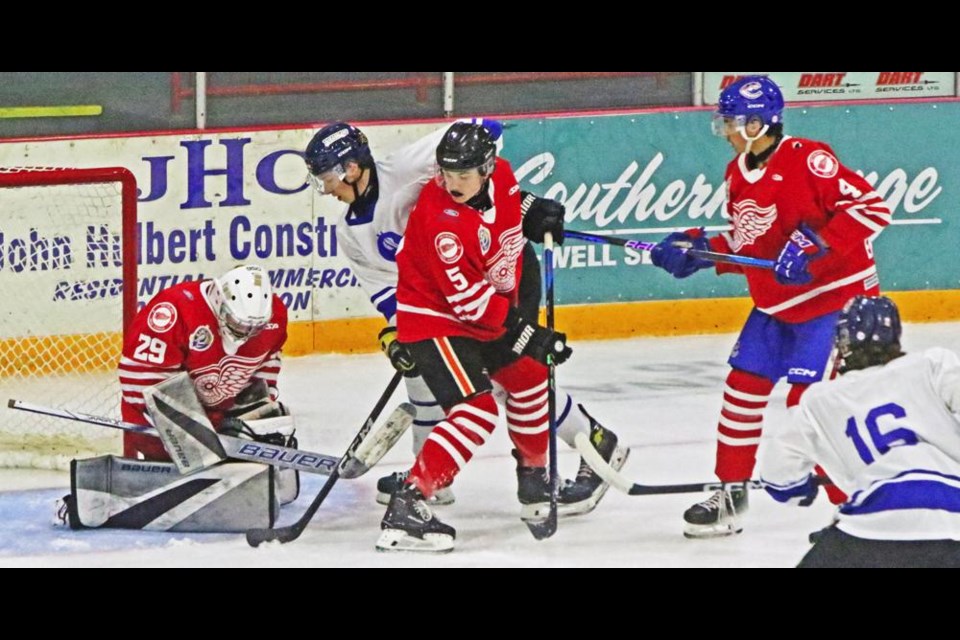 Red Wings goalie Nick Forsyth hung onto the puck on this play with Melville on Friday evening.