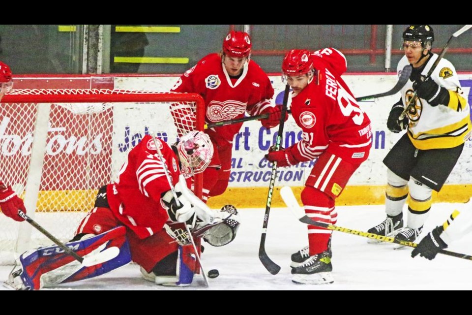 Goalie Dazza Mitchell stopped the puck with his goalie stick as teammate Jackson Ferry watched to ensure no Bruins player could get in to get the puck