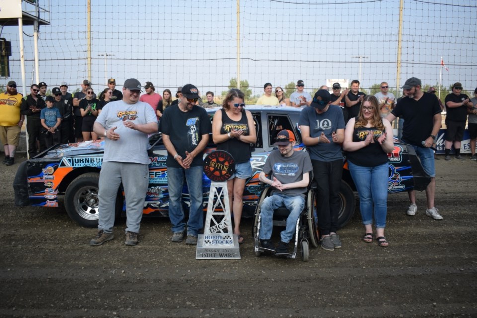 Riley Raynard and his family gather for a group photo. 