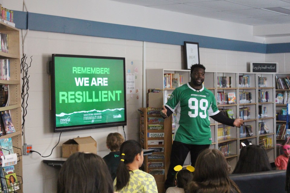 Charbel Dabire, pictured here delivering a mental health presentation for students at St. Alphonsus School.