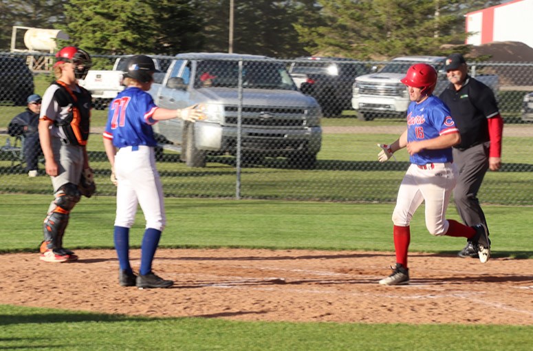 With the Supers trailing 3-1 to the visiting Saltcoats Lakers on June 19, Grady Wolkowski hammered a two-run homer over the right field fence in the fifth inning to tie the game at 3-3, which turned out to be the final score. On deck hitter Logan Wolkowski waited to congratulate Grady after he crossed the plate. 