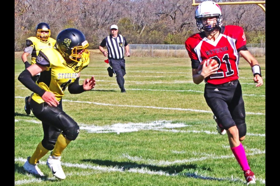 Weyburn U14 Falcons QB Hudson Maloney called his own number to make a running play against the SC Steelers on Saturday.