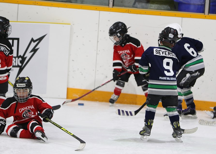 Players from the U7 Canora Cobras (red jerseys) and the Norquay North Stars battled for the puck all over the ice during their Hockey Day in Saskatchewan game on Jan. 19.