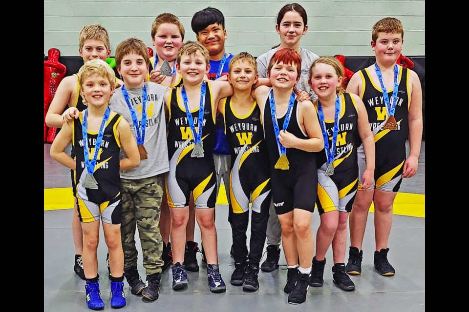 These are the medal winners from the Ascendant Wrestling Invitational tournament in Regina held on Feb. 3. In the back row from left to right are Landon Leroux, Hudson Fowler, Ezakiel Peralta, Avlynn Drake, Donovan Lanz; in the front row from left to right are Owen Pulfer, Rastyn Weiss, Jep Furgason, Owen Arthur, Conner Pocha, Sophie McLeod. 
Missing is Ephraim Henning and Lochlan Pirlot.