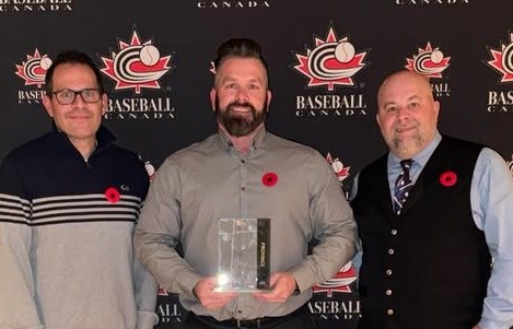 Regan L’Heureux, Mike Ramage and Scott Mills accept the Province of the Year award at the 2024 Baseball Canada Awards ceremony. 