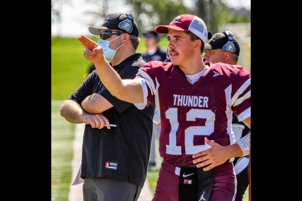 Zenon Orobko, number 12, playing backup quarterback for the Regina  Thunder of the Prairie Junior Football League.