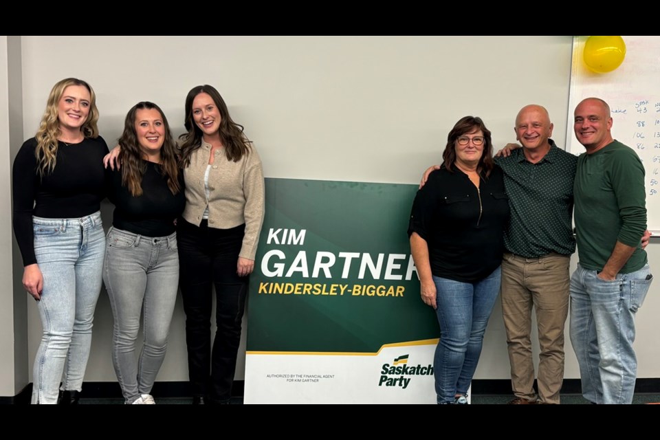 Saskatchewan Party candidate Kim Gartner poses with family following the results, naming him the new MLA for Kindersley-Biggar.