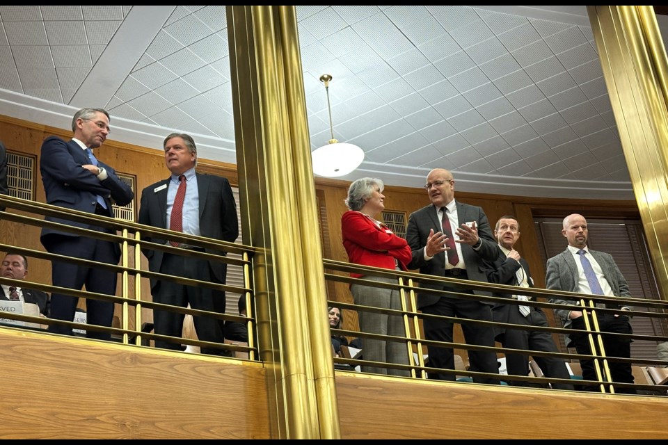 From left, North Dakota Republican Attorney General Drew Wrigley visits with state Supreme Court Justice Daniel Crothers on Wednesday, Dec. 4, 2024, in the balcony of the House of Representatives at the state Capitol in Bismarck, N.D., before Gov. Doug Burgum's budget address. The other members of the court, from left, are Justices Lisa Fair McEvers, Douglas Bahr, Chief Justice Jon Jensen and Justice Jerod Tufte. (AP Photo/Jack Dura)