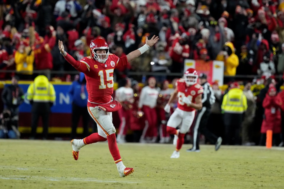 Kansas City Chiefs quarterback Patrick Mahomes (15) celebrates after defeating the Buffalo Bills in the AFC Championship NFL football game, Sunday, Jan. 26, 2025, in Kansas City, Mo. (AP Photo/Ed Zurga)