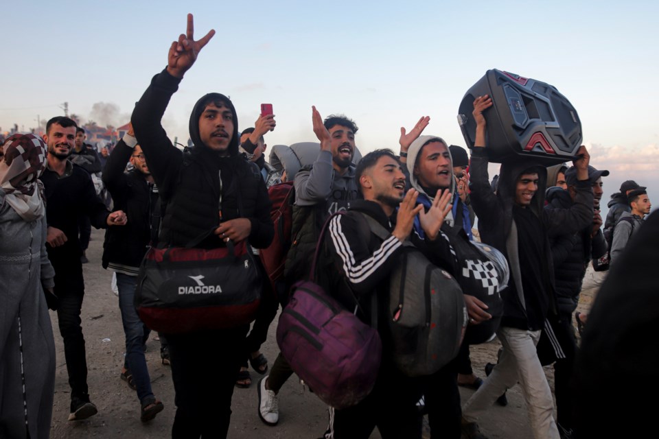 Displaced Palestinians celebrate as they return to their homes in the northern Gaza Strip, following Israel’s decision to allow thousands of them to go back for the first time since the early weeks of the 15-month war with Hamas in accordance with a fragile ceasefire, Monday, Jan. 27, 2025. (AP Photo/Jehad Alshrafi)