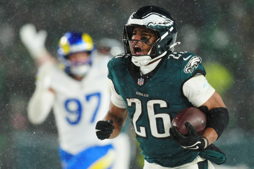 FILE - Philadelphia Eagles running back Saquon Barkley (26) runs the ball for a touchdown during the second half of an NFL football NFC divisional playoff game against the Los Angeles Rams on Sunday, Jan. 19, 2025, in Philadelphia. (AP Photo/Derik Hamilton, File)