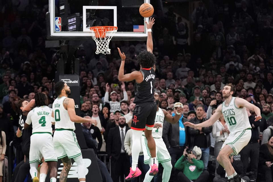 Houston Rockets forward Amen Thompson (1) makes the winning shot against the Boston Celtics during the final seconds of an NBA basketball game, Monday, Jan. 27, 2025, in Boston. (AP Photo/Charles Krupa)