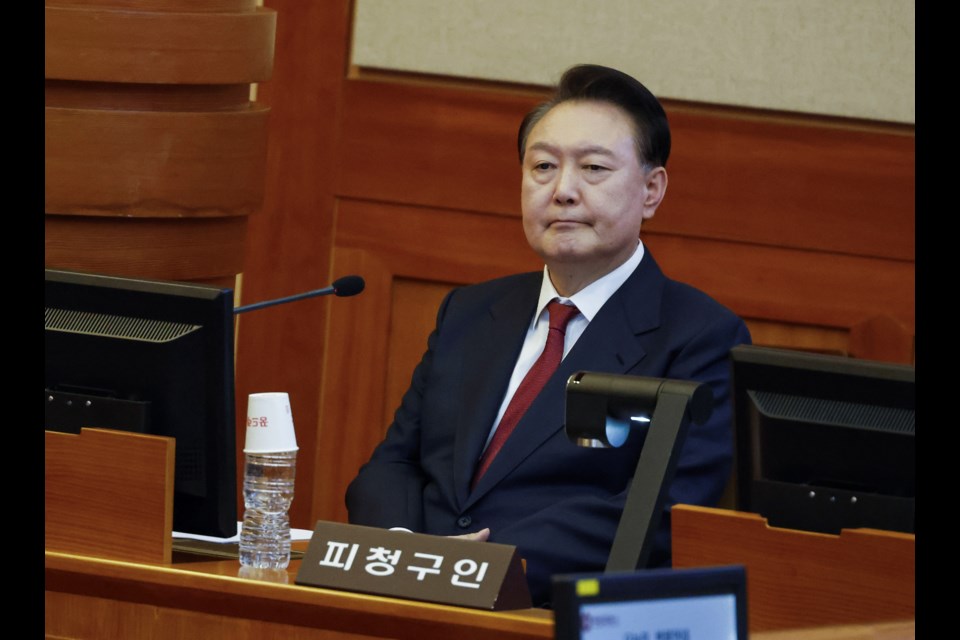 FILE- South Korea's impeached President Yoon Suk Yeol attends the fourth hearing of his impeachment trial over his short-lived imposition of martial law at the Constitutional Court in Seoul, South Korea, Thursday, Jan. 23, 2025. (Jeon Heon Kyun/Pool Photo via AP, File)