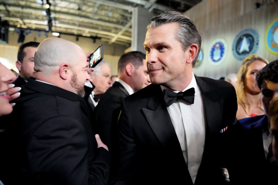 Defense Secretary nominee Pete Hegseth, center, attends the Commander in Chief Ball, Monday, Jan. 20, 2025, in Washington, after the 60th Presidential Inauguration. (AP Photo/Alex Brandon)