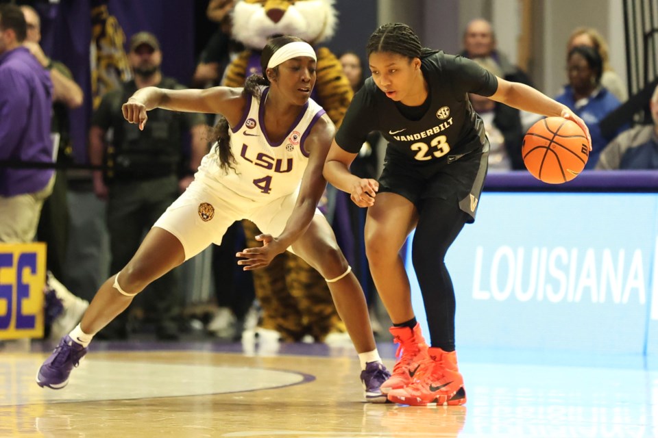 LSU guard Flau'Jae Johnson (4) defends against Vanderbilt guard Iyana Moore (23) during the second half of an NCAA college basketball game in Baton Rouge, La., Monday, Jan. 13, 2025. (AP Photo/Peter Forest)