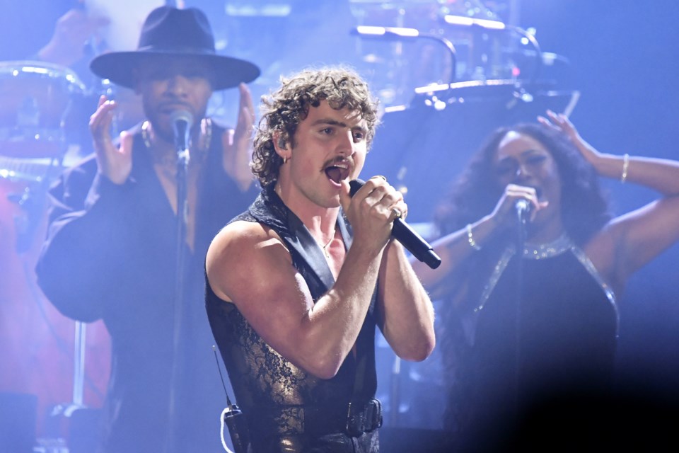 Benson Boone, center, performs during the Pre-Grammy Gala on Saturday, Feb. 1, 2025, at the Beverly Hilton Hotel in Beverly Hills, Calif. (Photo by Richard Shotwell/Invision/AP)