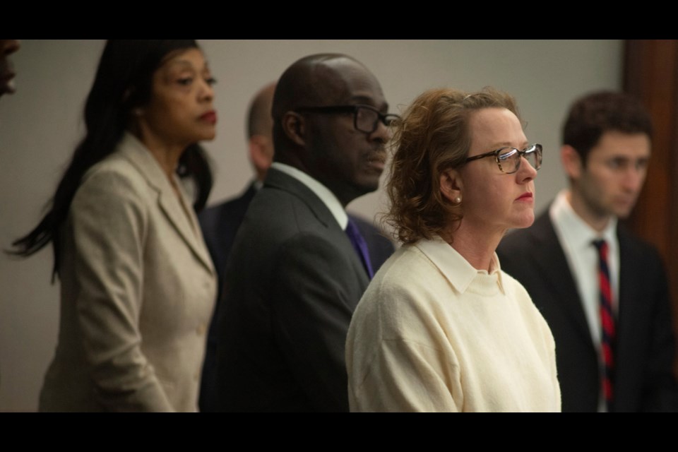 Former Brunswick Judicial Circuit Jackie Johnson stands with her defense team as court opens Thursday, Jan. 30, 2025, in Brunswick, Ga., where she is being tried on charges of violating her oath of office and obstruction of justice in the death of Ahmaud Arbery. (Terry Dickson/The Brunswick News via AP, Pool)