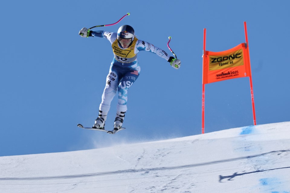 United States' Lindsey Vonn speeds down the course during an alpine ski, women's World Championship downhill training, in Saalbach-Hinterglemm, Austria, Tuesday, Feb. 4, 2025. (AP Photo/Marco Trovati)