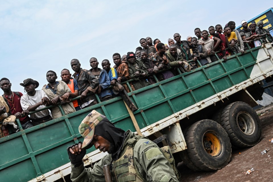 M23 rebels escort government soldiers and police who surrendered to an undisclosed location in Goma, Democratic Republic of the Congo, Thursday, Jan. 30, 2025.(AP Photo/Moses Sawasawa)