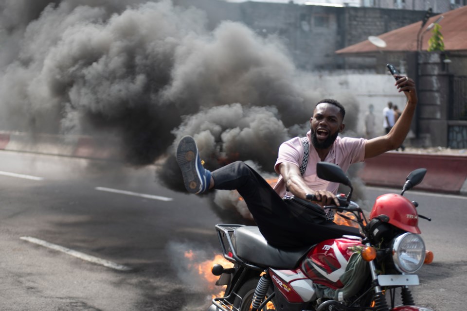 People protest in Kinshasa, Democratic Republic of the Congo Tuesday, Jan. 28, 2025, against the Rwanda-backed M23 rebels' advances into eastern Congo's capital Goma. (AP Photo/Samy Ntumba Shambuyi)