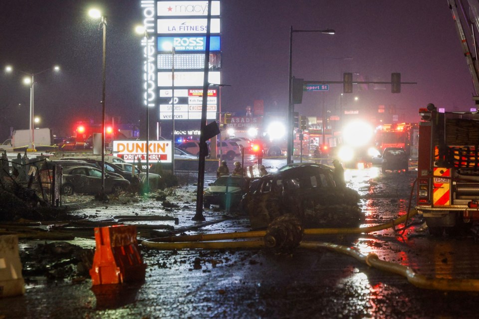 The scene near Roosevelt Boulevard after a small plane crashed near Roosevelt Mall, Friday, Jan. 31, 2025, in Philadelphia. (Steven M. Falk/The Philadelphia Inquirer via AP)