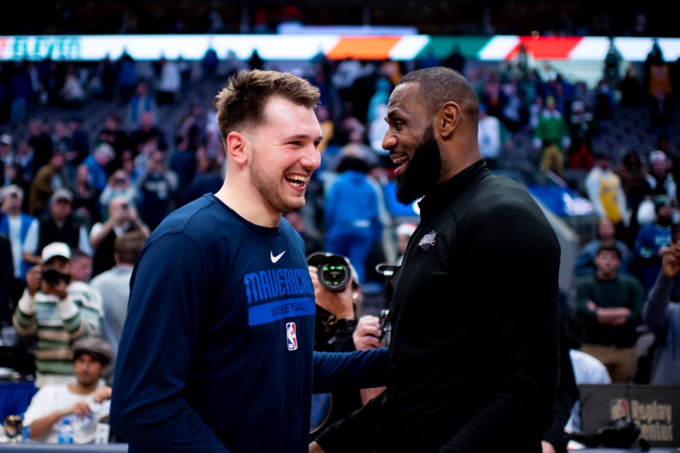 FILE - Dallas Mavericks guard Luka Doncic shares a laugh with Los Angeles Lakers forward LeBron James following an NBA basketball game in Dallas, Dec. 25, 2022. Dallas won the game by a final of 124-115. (AP Photo/Emil T. Lippe, File)