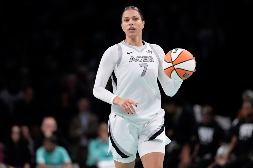 FILE - Las Vegas Aces' Alysha Clark (7) looks to pass during the second half of a WNBA basketball semifinal game against the New York Liberty, Oct. 1, 2024, in New York. (AP Photo/Frank Franklin II, File)