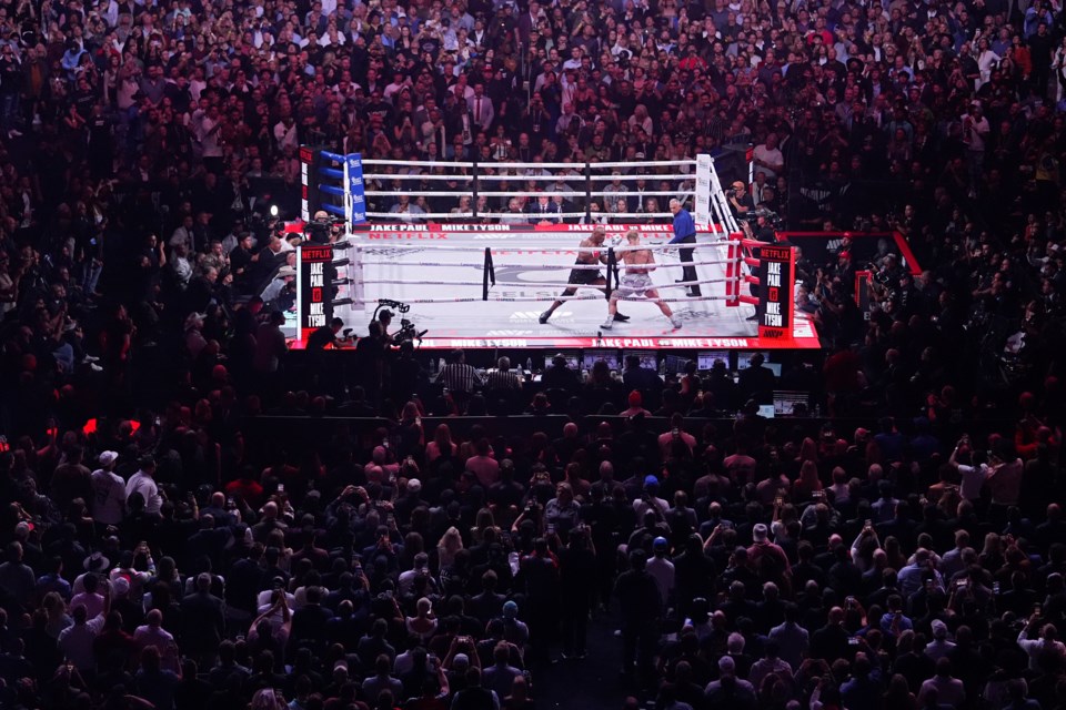 FILE - Mike Tyson, left, fights Jake Paul during their heavyweight boxing match, Nov. 15, 2024, in Arlington, Texas. (AP Photo/Julio Cortez, File)