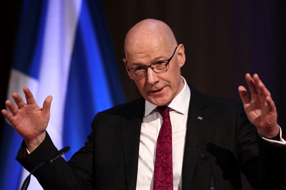 Scotland's First Minister John Swinney gestures during a speech to representatives from organisations across the public and private sector at Playfair Library in Edinburgh, Scotland, Monday, Jan. 6, 2025. (Jeff Mitchell/PA via AP)