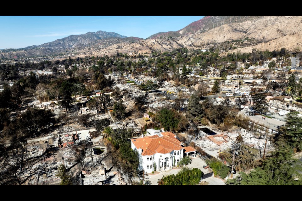 FILE - A lone home stands among residences levelled by the Eaton Fire in Altadena, Calif., on Tuesday, Jan. 21, 2025. (AP Photo/Noah Berger, File)