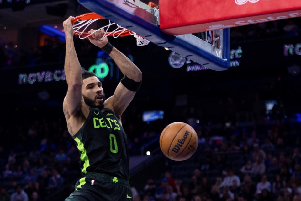 Boston Celtics' Jayson Tatum dunks during the first half of an NBA basketball game against the Philadelphia 76ers, Sunday, Feb. 2, 2025, in Philadelphia. (AP Photo/Chris Szagola)