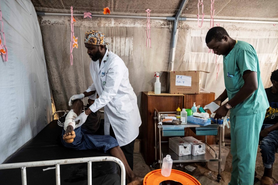 Medics treat a man wounded during fighting between Congolese government troops and M23 rebel forces in Goma's Kyeshero hospital Saturday, Feb. 1, 2025. (AP Photo/Moses Sawasawa)