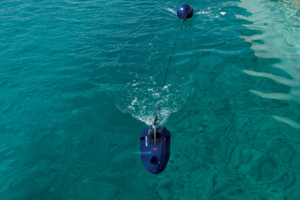 An underwater drone passes inside the seawater during a demonstration at a Marina in the southern resort of Ayia Napa, Cyprus, Monday, Feb. 24, 2025. (AP Photo/Petros Karadjias)