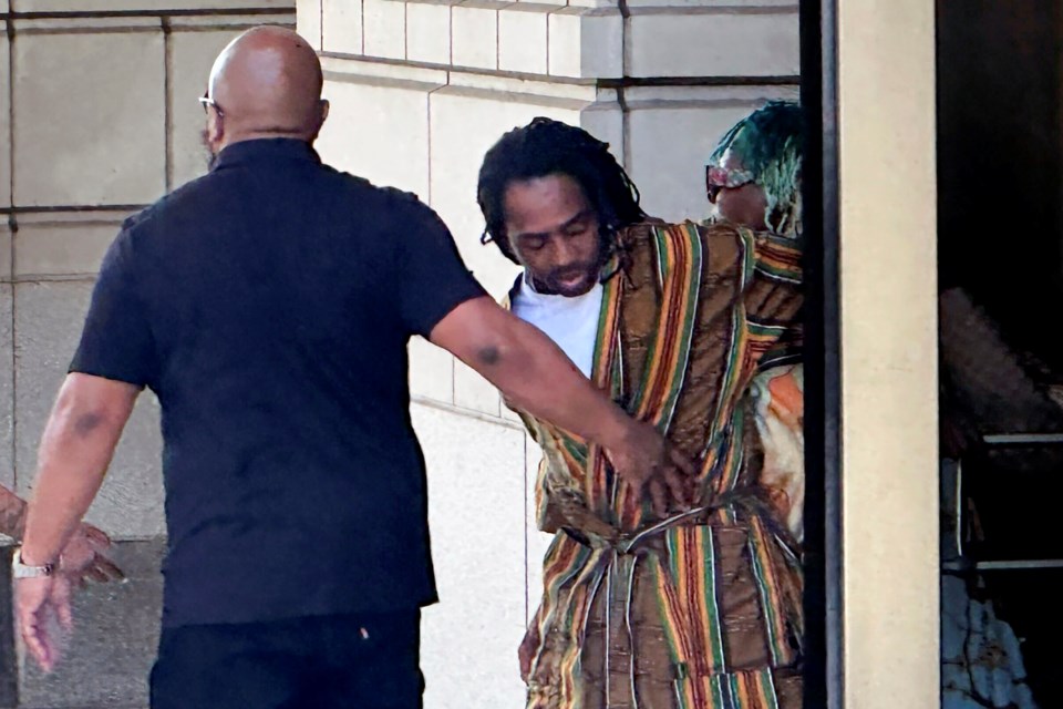 FILE - District of Columbia Councilman Trayon White, center, walks out of the federal courthouse after his initial appearance, Aug. 19, 2024 in Washington. (AP Photo/Michael Kunzelman, File)