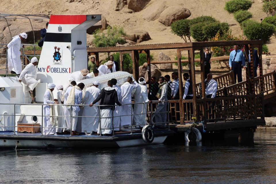 People carry the coffin of Prince Karim Al-Hussaini, the Aga Khan IV and 49th hereditary imam of the Shiite Ismaili Muslims, who died Tuesday in Portugal, to be buried at the Aga Khan mausoleum, in Aswan, Egypt, Sunday, Feb. 9, 2025. (AP Photo/Haytham Fahmy)