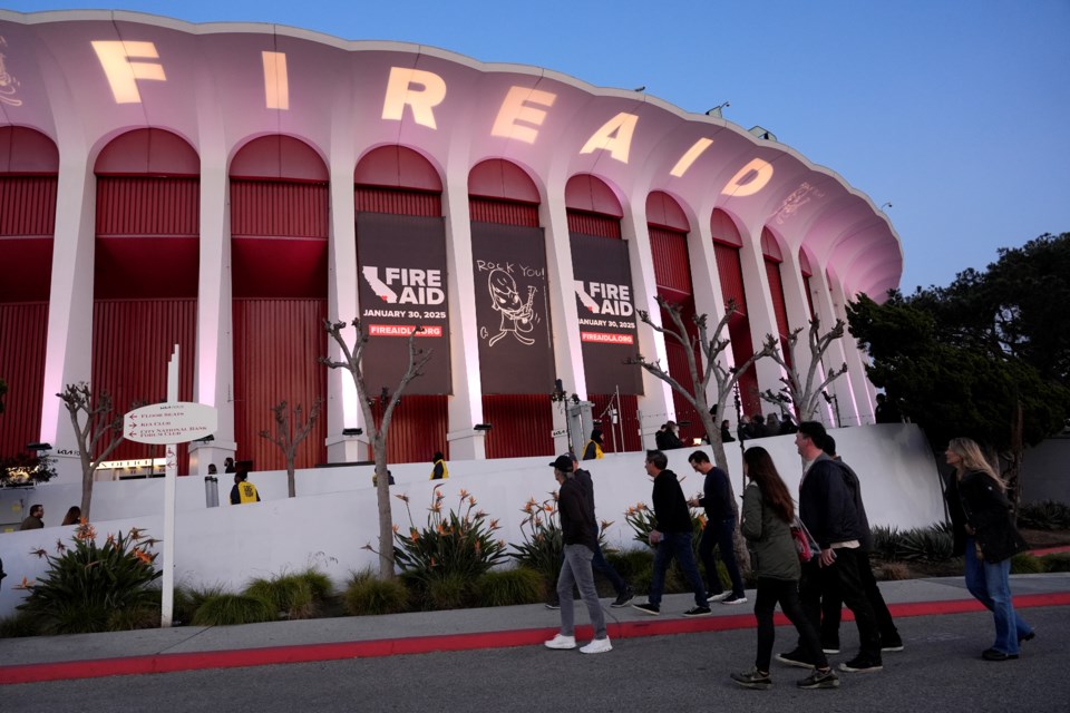 A general view of atmosphere is pictured outside the Forum prior to the FireAid benefit concert on Thursday, Jan. 30, 2025, in Inglewood, Calif. (AP Photo/Chris Pizzello)