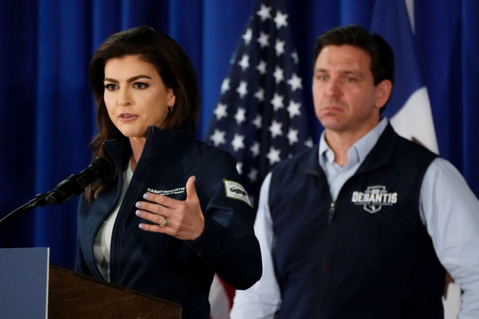 FILE - Florida first lady Casey DeSantis speaks as her husband Republican presidential candidate Florida Gov. Ron DeSantis looks on during a campaign event, Wednesday, May 31, 2023, in Cedar Rapids, Iowa. (AP Photo/Charlie Neibergall, File)